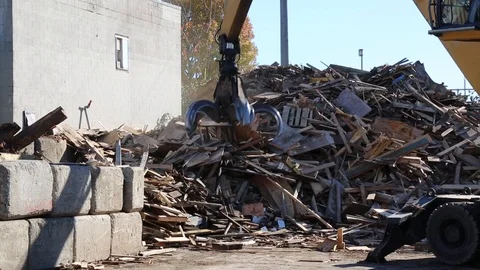 Industrial claw machine moving garbage construction site Stock-Footage 107790566