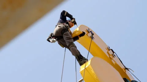 Industrial Climber Works at a Height of Weld Design. Stock Footage 63534597