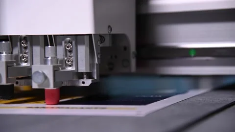Industrial A close-up of an industrial plotter cuts a template on a cardboard 動画素材 162547588