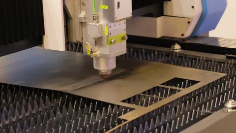 Industrial cnc laser cutter machine processing metal sheet with sparks in m.. Stock Footage 337348852