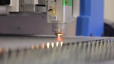 Industrial cnc laser cutter machine working on metal sheet in factory. Stock Footage 337351529