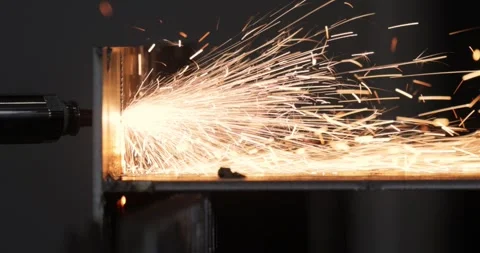 Industrial CNC laser cutting machine with flying sparks in metal fabrication. Stock Footage 343408499