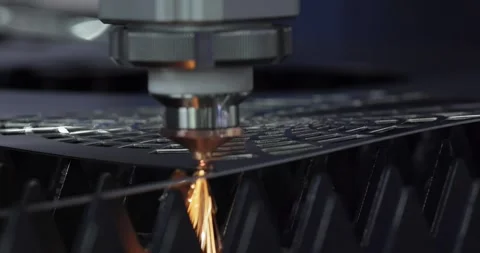 Industrial CNC laser cutting machine with flying sparks in metal fabrication. Stock Footage 345584525