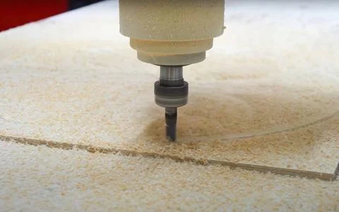 Industrial CNC machine in action close-up wood cutting process Stock Photos