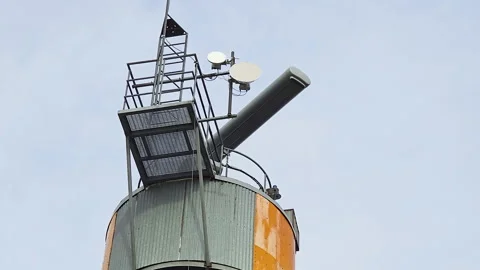 Industrial communication tower against sky Stock Footage 269972887