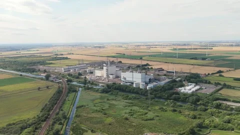 Industrial Complex Aerial View Surrounded by Green Fields, Railway, and Wind Video stock 340273219