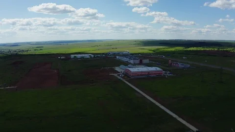 Industrial complex among green fields panoramic view Видео 120647893