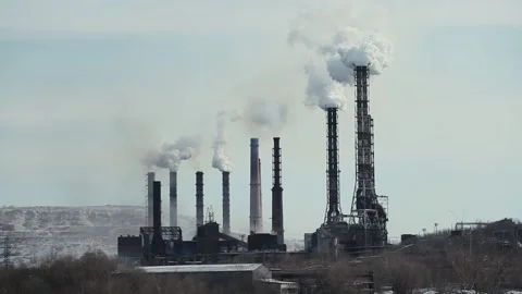 Industrial Complex with Chimneys with White Smoke against A Cloudy Sky Stock Footage 153325169