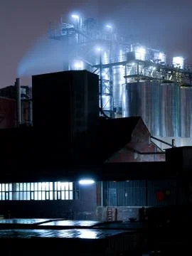 Industrial complex at night Stock Photos