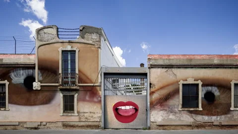 Industrial complex overlayed with eyes and lips visuals on the brick wall Vídeos de archivo 316099763