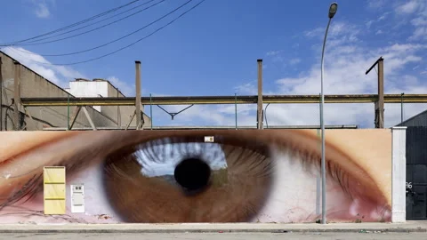 Industrial complex overlayed with eyes visuals on the brick wall Stock Footage 316101024