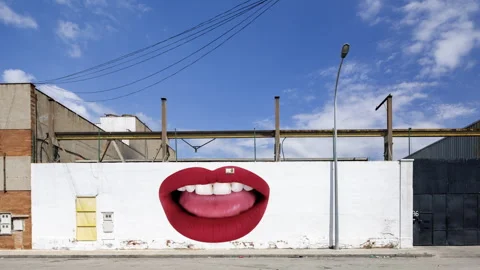 Industrial complex overlayed with red lips visuals on the brick wall Stock Footage 316100451