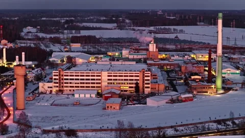 Industrial complex producing materials during winter in evening light at Video stock 330896862