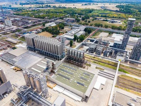 Industrial complex viewed from above showing large storage bins and process.. Stock Photos