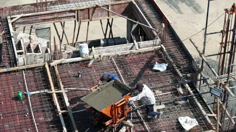 Industrial Concrete Pouring Machine Operator Working on Building Site Stock Footage 344036649