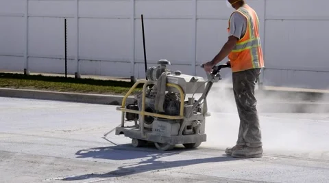 Industrial Consrtuction worker w machine on road 1 Stockbeeldmateriaal 68015132
