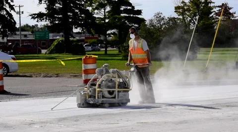 Industrial Consrtuction worker w machine on road 4 Stockbeeldmateriaal 68015442