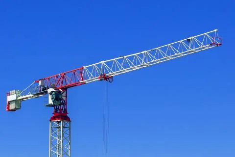 Industrial construction crane or column-jib crane with cabin works on the Stock Photos