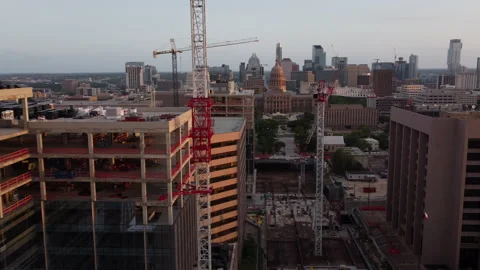 Industrial construction of high-rises with tower crane machinery develop real Stock Footage 155136359