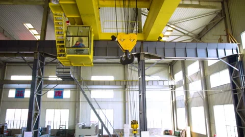 Industrial construction worker crane in hard hat safety vest operator cabin Stock Footage 348192382