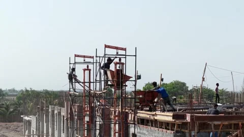 Industrial Construction Workers Operating Concrete Loading Equipment on Stock Footage 344230172