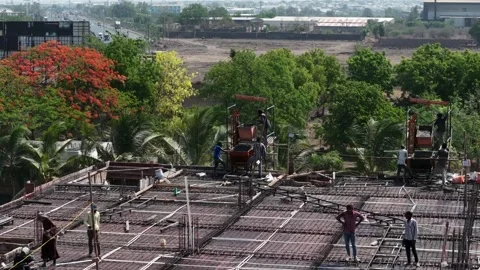 Industrial Construction Workers Using Hoist on Building Rooftop in Rural Stock Footage 344477474