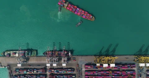Industrial Container Ship Maneuvering Into Harbor Port Aerial Shot Video stock 335680925
