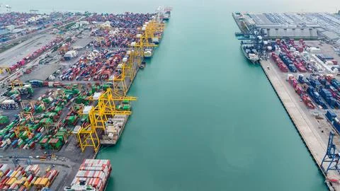 Industrial Container Terminal With Yellow Loading Cranes At Maritime Port H.. Stock Photos