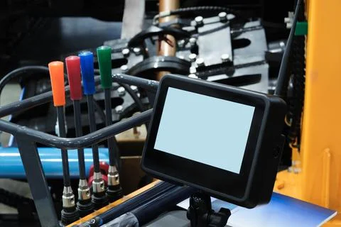 Industrial control panel with blank touchscreen display. Metal framework hold Stock Photos