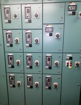 Industrial Control Panel with Green Panels and Indicator Lights Stock Photos
