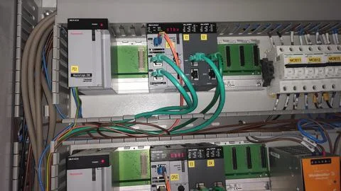 Industrial control panel with various components and wiring for automation .. Stock Photos