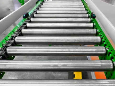 Industrial conveyor system transporting items efficiently in a warehouse setting Stock Photos