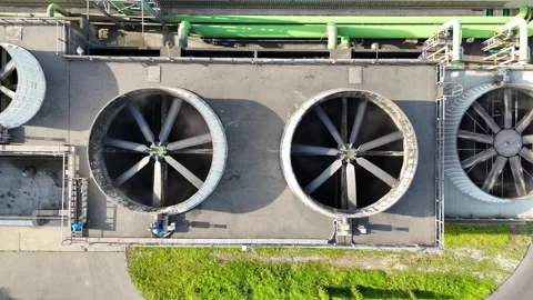 Industrial cooling system with large ventilation fans rotating above Видео 335661182