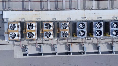 Industrial cooling units on a data center building, managing heat for Stock Footage 334012640