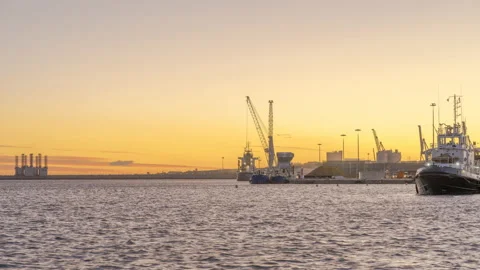 Industrial Crane working at Harbour loading ship Sunset Timelapse 4K Stock Footage 174692310