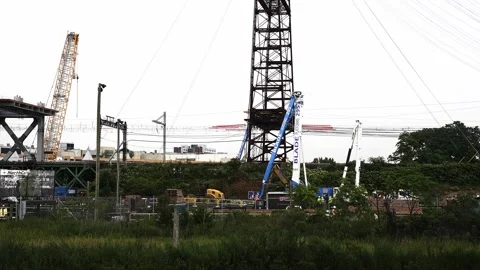 Industrial cranes working on walk bridge construction Stock Footage 343991039