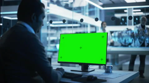 Industrial Developer Working on Computer with Green Screen Video stock 229841418