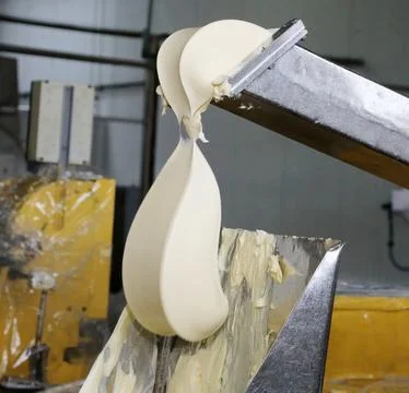 Industrial dough processing at a manufacturing facility Stock Photos