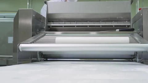 Industrial Dough Sheeter Machine Processing Pastry for Automated Bakery Producti Stock Footage 337751387