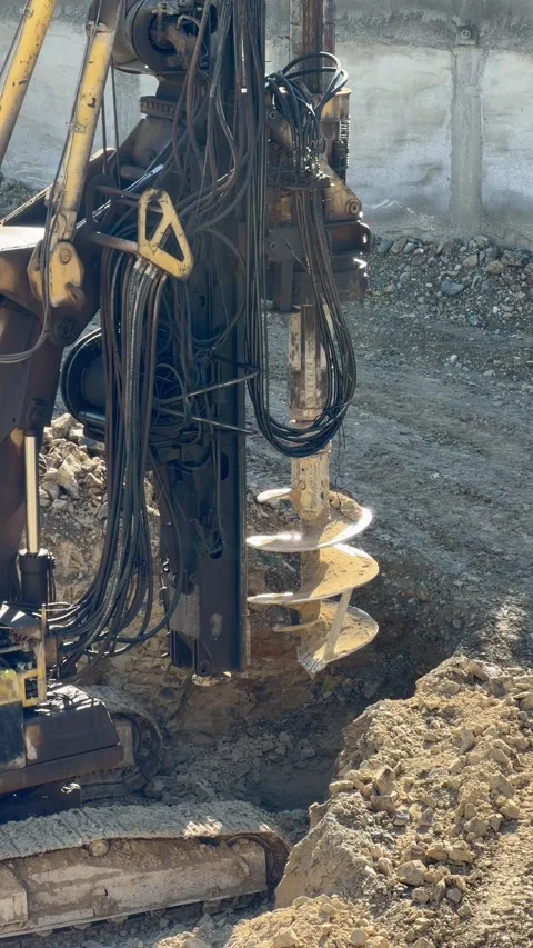 Industrial drilling machine working with ground on building site supports Video stock 329279047