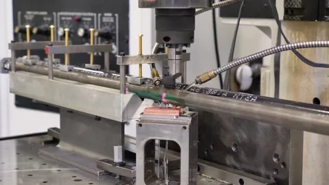 Industrial drilling machine working on metal pipe with cooling liquid in au.. Stock Footage 337401250