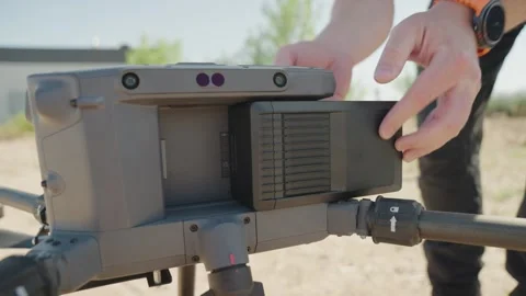 Industrial Drone Battery Insertion Close-Up Technician Installing Power Pack Stock Footage 331139273