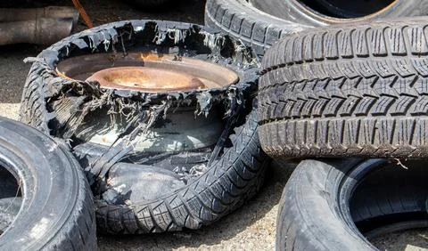 Industrial dump for the processing of used tires and rubber tires. Pile of ol Stock-Fotos