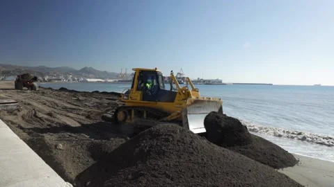 Industrial dumper trucks working at the construction in the beach coast Stock Footage 141059948