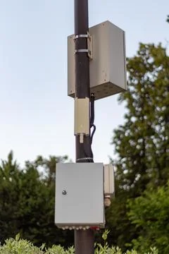 Industrial electrical control boxes and junction boxes mounted on a metal Stock Photos