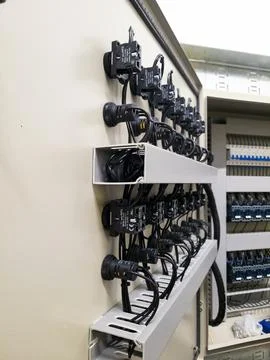 Industrial electrical control panel with switches and wiring system Stock Photos