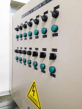 Industrial electrical control panel with switches and wiring system Stock Photos