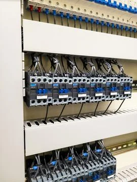 Industrial electrical control panel with wiring and circuit breakers Stock Photos