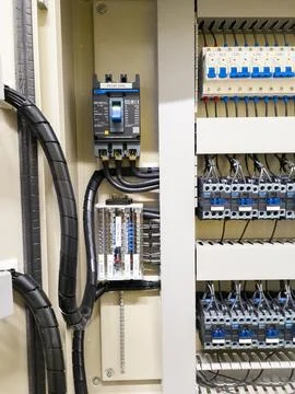 Industrial electrical control panel with wiring and circuit breakers Stock Photos