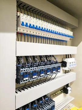 Industrial electrical control panel with wiring and circuit breakers Stock Photos